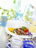 Rolls of Young Venison with Nasturtium Flowers