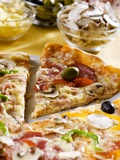 Pizza with a Slice Cut and Pizza Ingredients