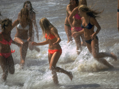 Bikini Clad Teens Frolicking in Surf at Beach Premium Photographic Print