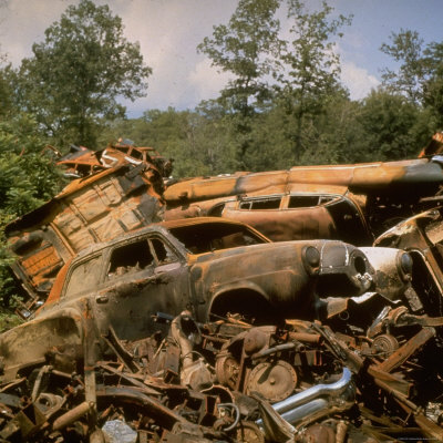 Pile of Rusted Car Shells in an Automobile Junkyard Premium Photographic