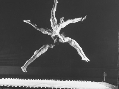 Multiple Exposure Shot of a Gymnast Jumping on a Trampoline Premium 