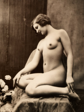 Nude Portrait of a Young Woman Seated with Her Legs Curled Up Photographic