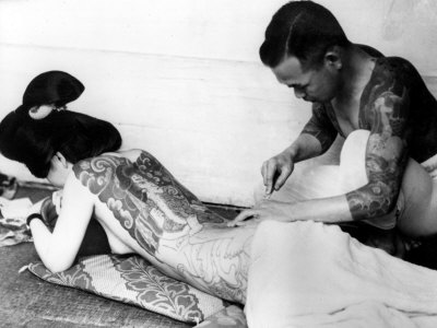 An Unidentified Japanese Tattoo Artist Works on a Woman's Backside 