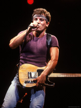 Singer Bruce Springsteen Playing Guitar While Performing on Stage Premium 