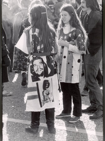 Two Young Teenage Hippie Girls Wearing Outfits Incorporating Stars and