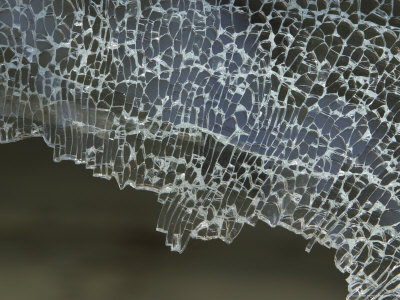 Closeup of Cracked and Shattered Glass with a Jagged Edge Photographic