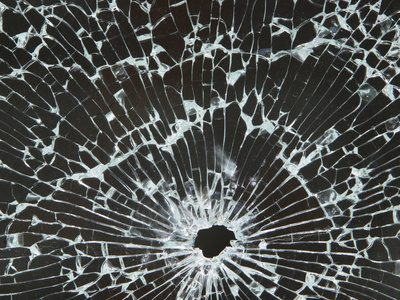 Closeup of a Hole in Cracked and Shattered Glass Photographic Print