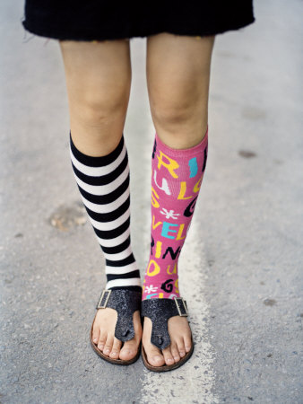 Young Girl's Feet in a Black Miniskirt and Mismatched Socks Photographic 