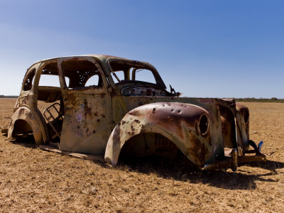 Old Abandoned Car in Fallow Field Photographic Print zoom view in room