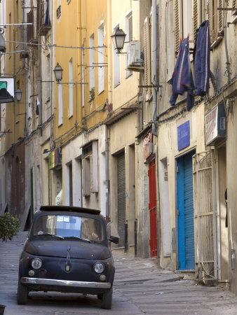 Fiat Driving in Narrow Street, Sassari, Sardinia, Italy Stretched Canvas Print