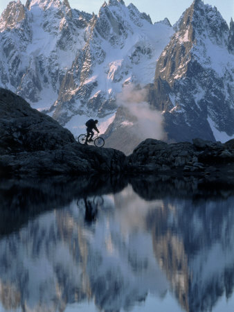 Person on a Mountain Bicycle in the Alps Other Person on a Mountain Bicycle in the Alps Other