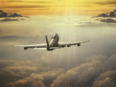 Airplane Flying in Sky Stretched Canvas Print