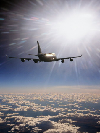 Airplane Flying Through Clouds Stretched Canvas Print