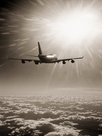 Airplane Flying Through Clouds Stretched Canvas Print