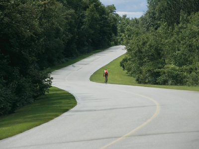 "A Cyclist on a Scenic Drive in Gatineau Park" Photographic Print