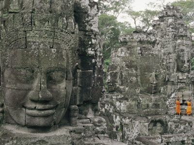 Two Monks in Orange Robes are Standing Near a Buddhist Temple Stretched Canvas Print