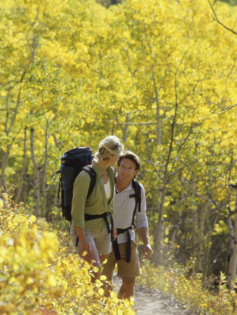 A Young Couple Hiking in the Woods Photographic Print A Young Couple Hiking in the Woods Photographic Print