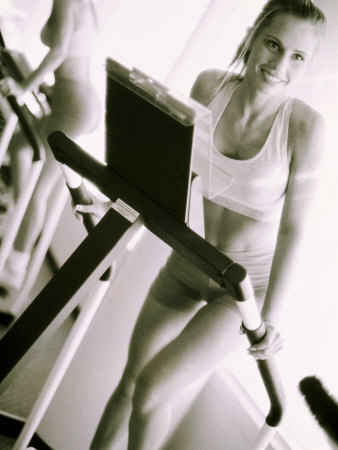 Young Woman Running on a Treadmill Photographic Print Young Woman Running on a Treadmill Photographic Print