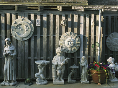 Sculpture Statues on Concrete Statues  Bird Baths And Sculpture Against A Wooden Fence