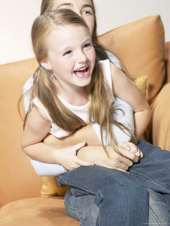 Girl Sitting on Sister Photographic Print Girl Sitting on Sister Photographic Print
