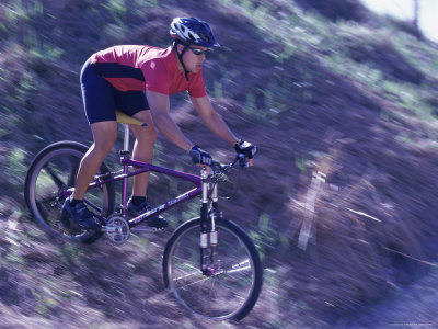 Young Man Cycling Down a Hill Photographic Print Young Man Cycling Down a Hill Photographic Print