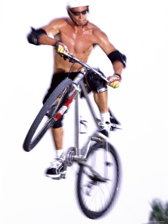 Young Man on a Bicycle in Mid-Air Photographic Print Young Man on a Bicycle in Mid-Air Photographic Print