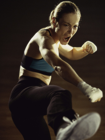 Young Woman Kickboxing Photographic Print Young Woman Kickboxing Photographic Print