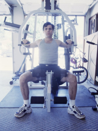 Man Exercising on a Chest Expander Photographic Print Man Exercising on a Chest Expander Photographic Print