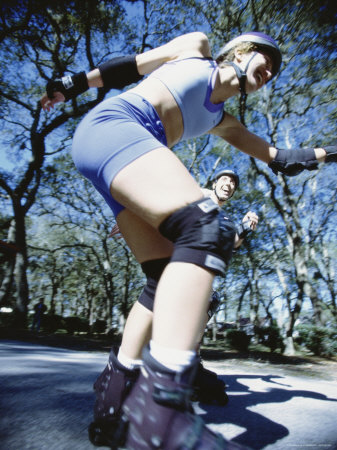 Young Woman Inline Skating on Road Photographic Print Young Woman Inline Skating on Road Photographic Print