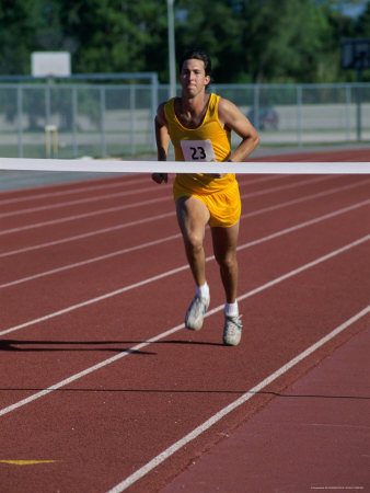 Male Runner Crossing a Finishing Line Photographic Print Male Runner Crossing a Finishing Line Photographic Print