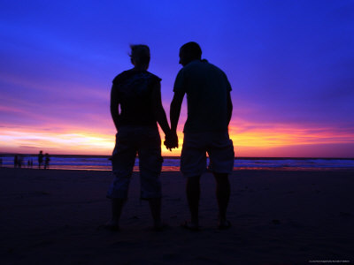 couples holding hands pictures. Silhouette of a Couple Holding