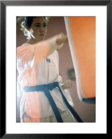 Young Woman Practicing Karate Framed Print Young Woman Practicing Karate Framed Print