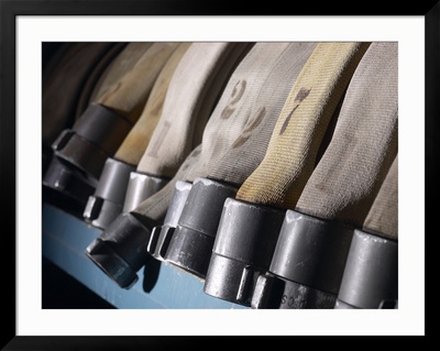 Row of Fire Hoses Framed Print Row of Fire Hoses Framed Print
