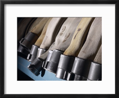 Row of Fire Hoses Framed Print Row of Fire Hoses Framed Print