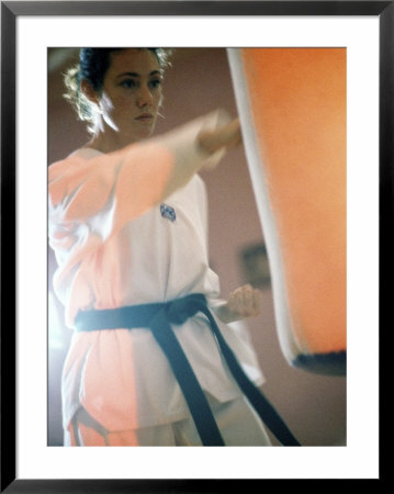 Young Woman Practicing Karate Framed Print Young Woman Practicing Karate Framed Print