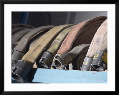 Row of Fire Hoses Framed Print Row of Fire Hoses Framed Print