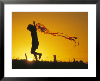 Child Flying A Kite At Sunset Framed Print Child Flying A Kite At Sunset Framed Print