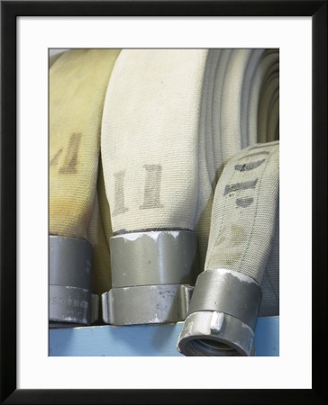 Row of Fire Hoses Framed Print Row of Fire Hoses Framed Print