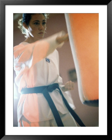Young Woman Practicing Karate Framed Print Young Woman Practicing Karate Framed Print