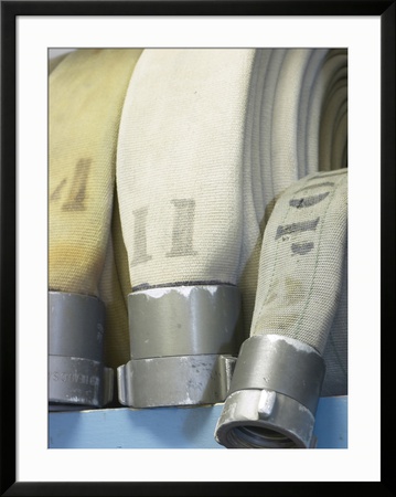 Row of Fire Hoses Framed Print Row of Fire Hoses Framed Print