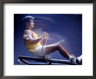 Man on rowing machine Framed Print Man on rowing machine Framed Print