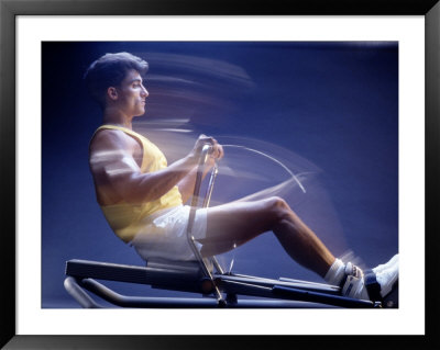 Man on rowing machine Framed Print Man on rowing machine Framed Print