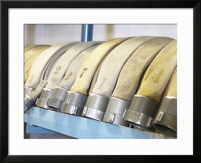 Row of Vintage Fire Hoses Framed Print Row of Vintage Fire Hoses Framed Print
