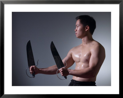Man with Ceremonial Swords Framed Print Man with Ceremonial Swords Framed Print