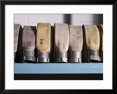 Row of Fire Hoses Framed Print Row of Fire Hoses Framed Print
