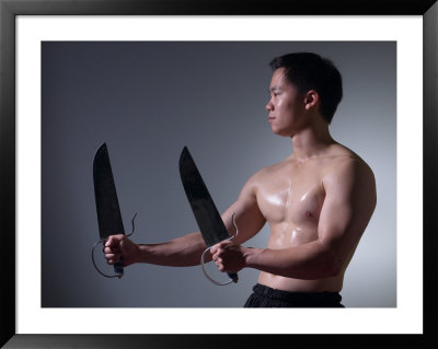 Man with Ceremonial Swords Framed Print Man with Ceremonial Swords Framed Print