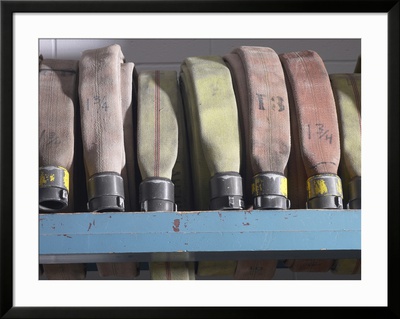 Row of Fire Hoses Framed Print Row of Fire Hoses Framed Print