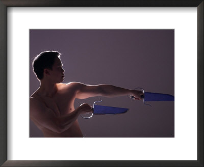 Man with Ceremonial Swords Framed Print Man with Ceremonial Swords Framed Print