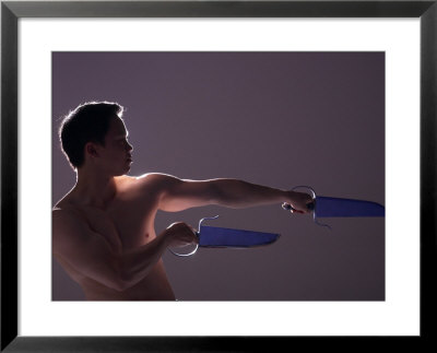 Man with Ceremonial Swords Framed Print Man with Ceremonial Swords Framed Print