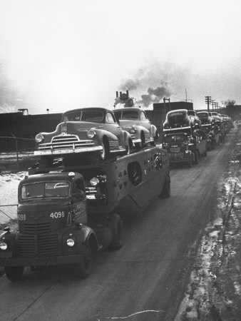 Newly-Made Pontiacs Being Transported on Trucks Stretched Canvas Print